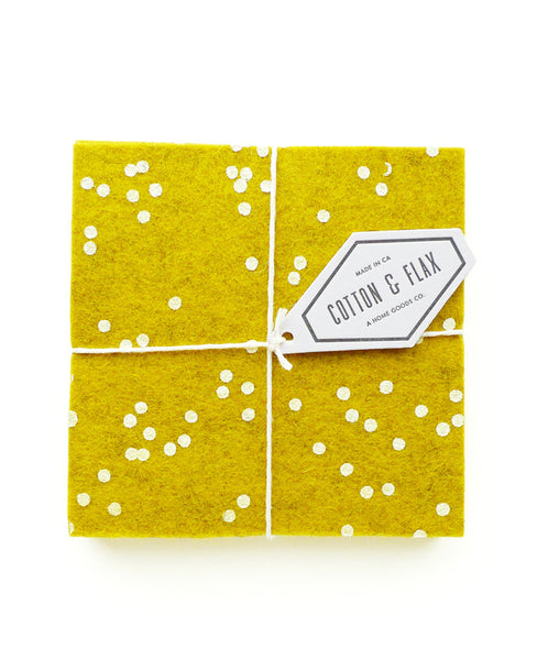 Gold confetti coasters packaged with twine and a white branded tag