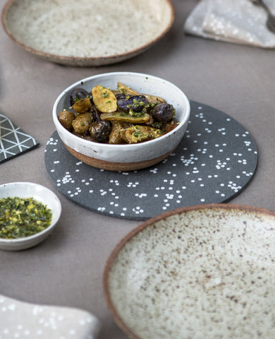 Dinner table set with a Confetti Trivet from Cotton & Flax