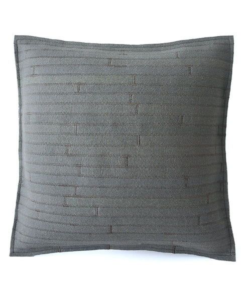 Reverse side of a grey wool felt throw pillow