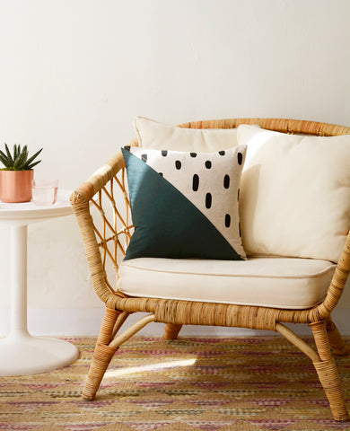Quilted throw pillow from Cotton & Flax in a boho chair