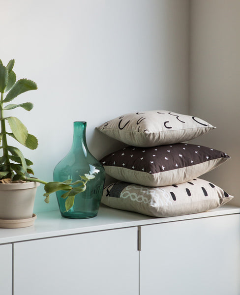 Stack of modern linen throw pillows