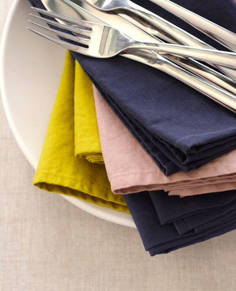 Pile of multicolor linen napkins from Cotton & Flax
